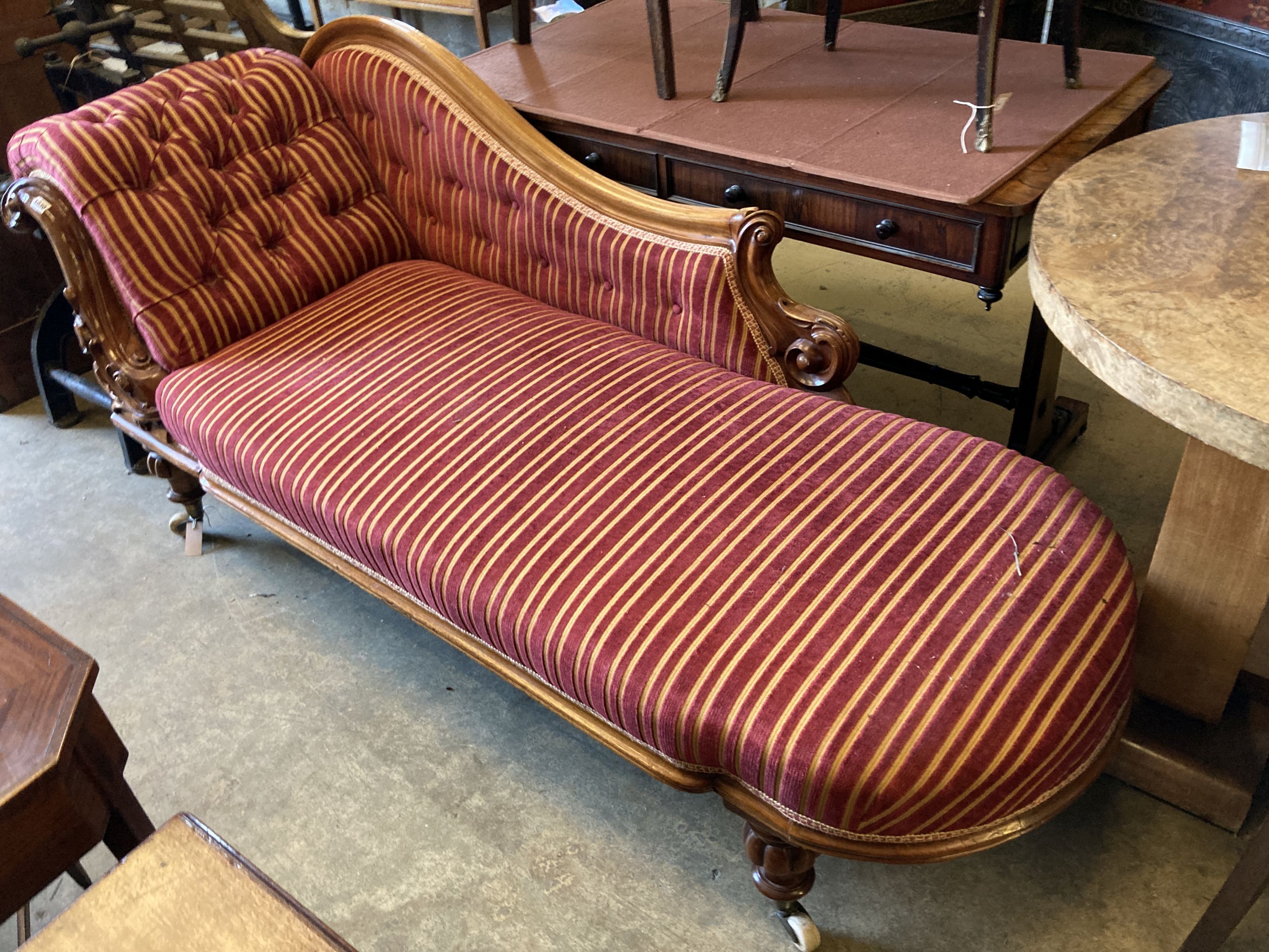 A Victorian carved walnut chaise longue, length 200cm, depth 74cm, height 88cm